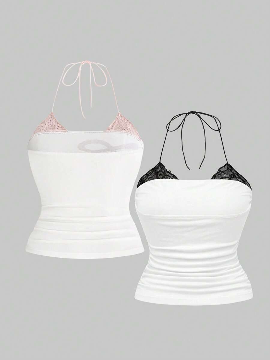 Multicolor graphic crop halter top with contrast lace trim and knot detail in a slim fit stretch knit fabric.