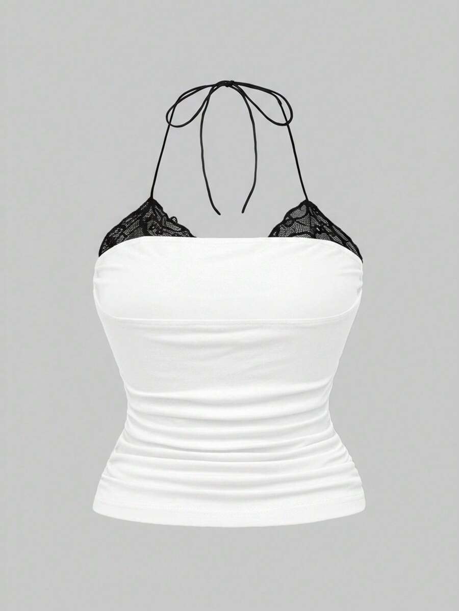 Multicolor graphic crop halter top with contrast lace trim and knot detail in a slim fit stretch knit fabric.