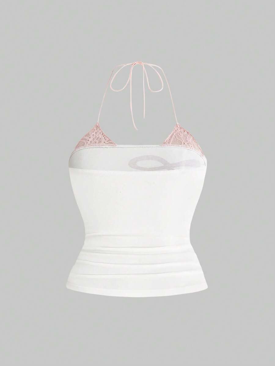 Multicolor graphic crop halter top with contrast lace trim and knot detail in a slim fit stretch knit fabric.