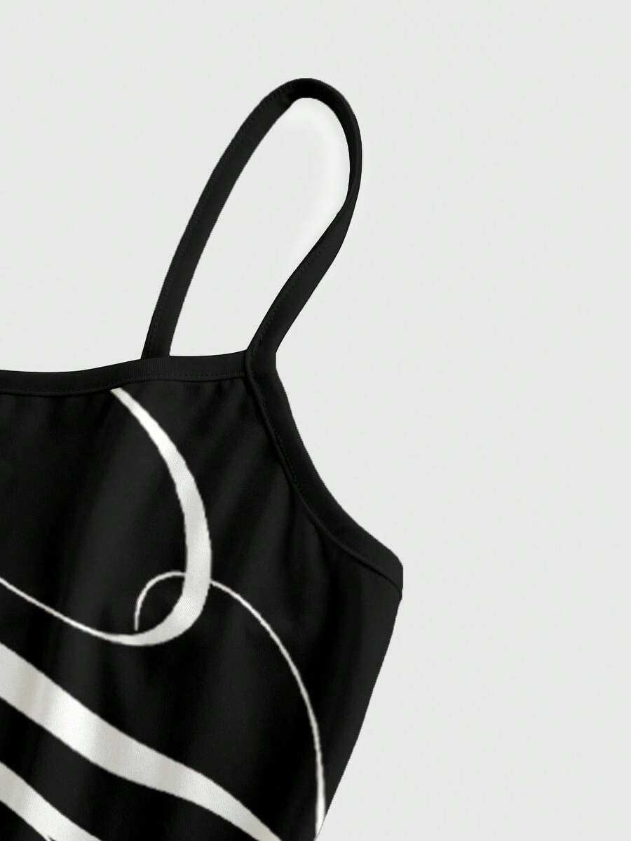 Women's black backless cami mini dress featuring spaghetti straps, lettuce trim, and a flared hem in high stretch knitted fabric.