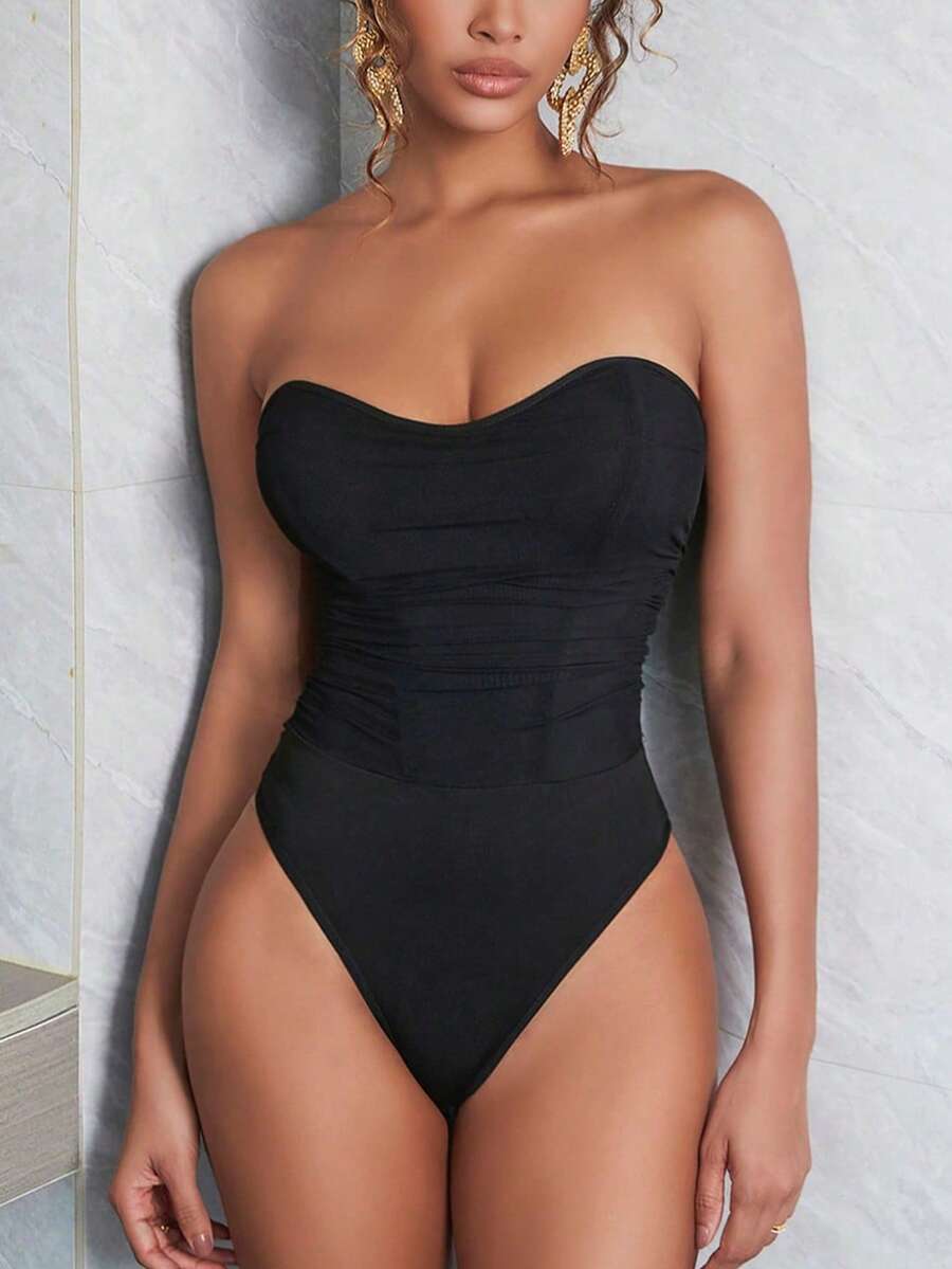 Black mesh ruched tube corset top for women featuring a strapless and backless slim fit design.