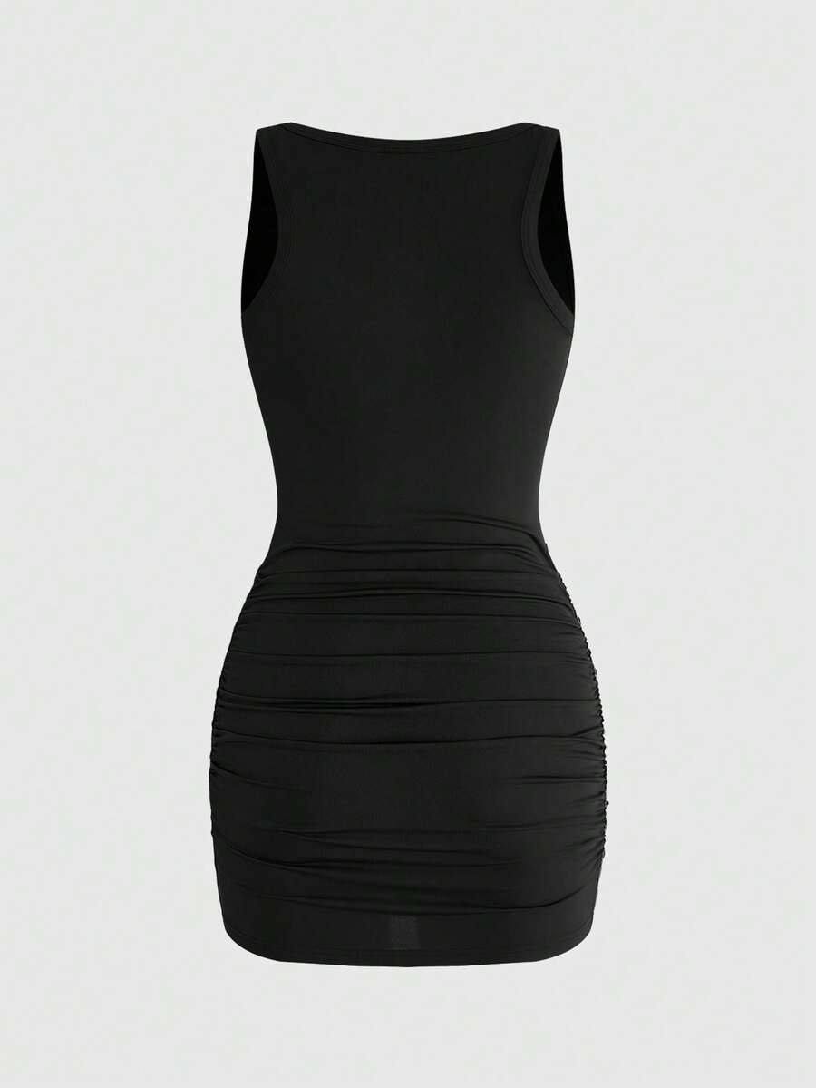 Women's black contrast lace bodycon mini dress with ruched details, scoop neckline, and studded accents.