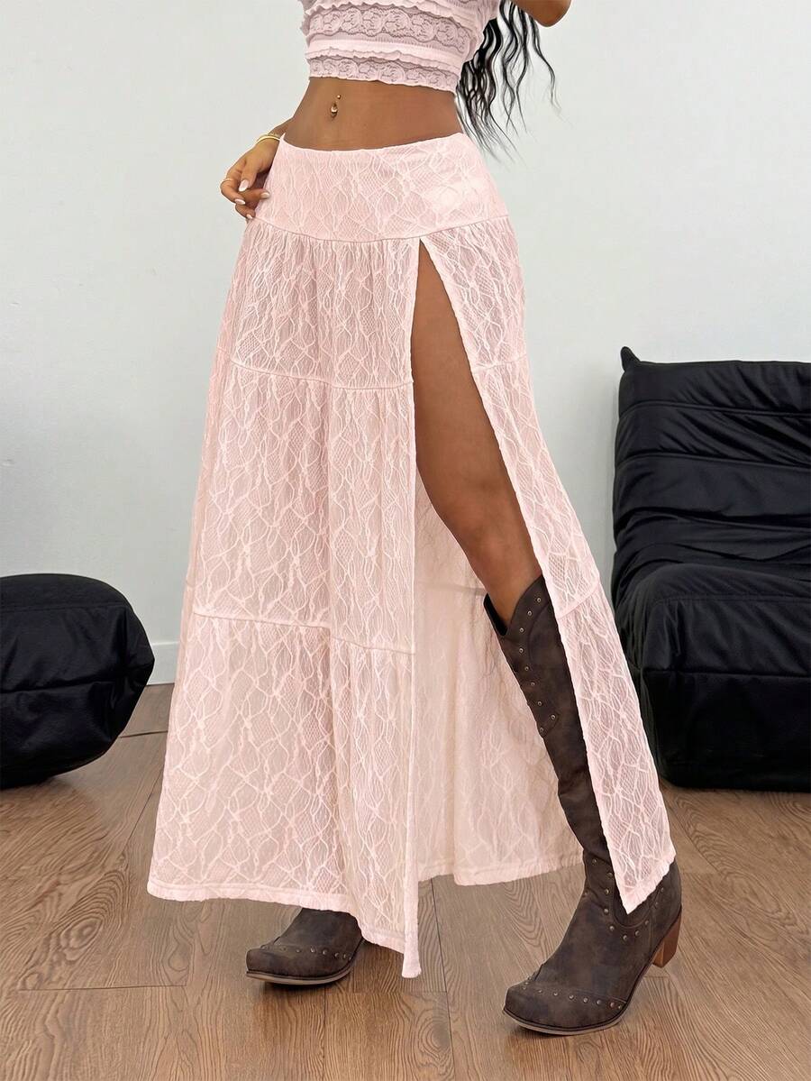 Women's black low waist split thigh long skirt featuring semi-sheer textured fabric and a flared skinny fit.