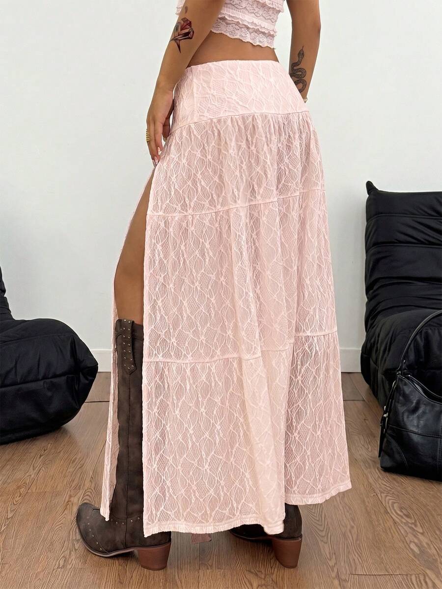 Women's black low waist split thigh long skirt featuring semi-sheer textured fabric and a flared skinny fit.