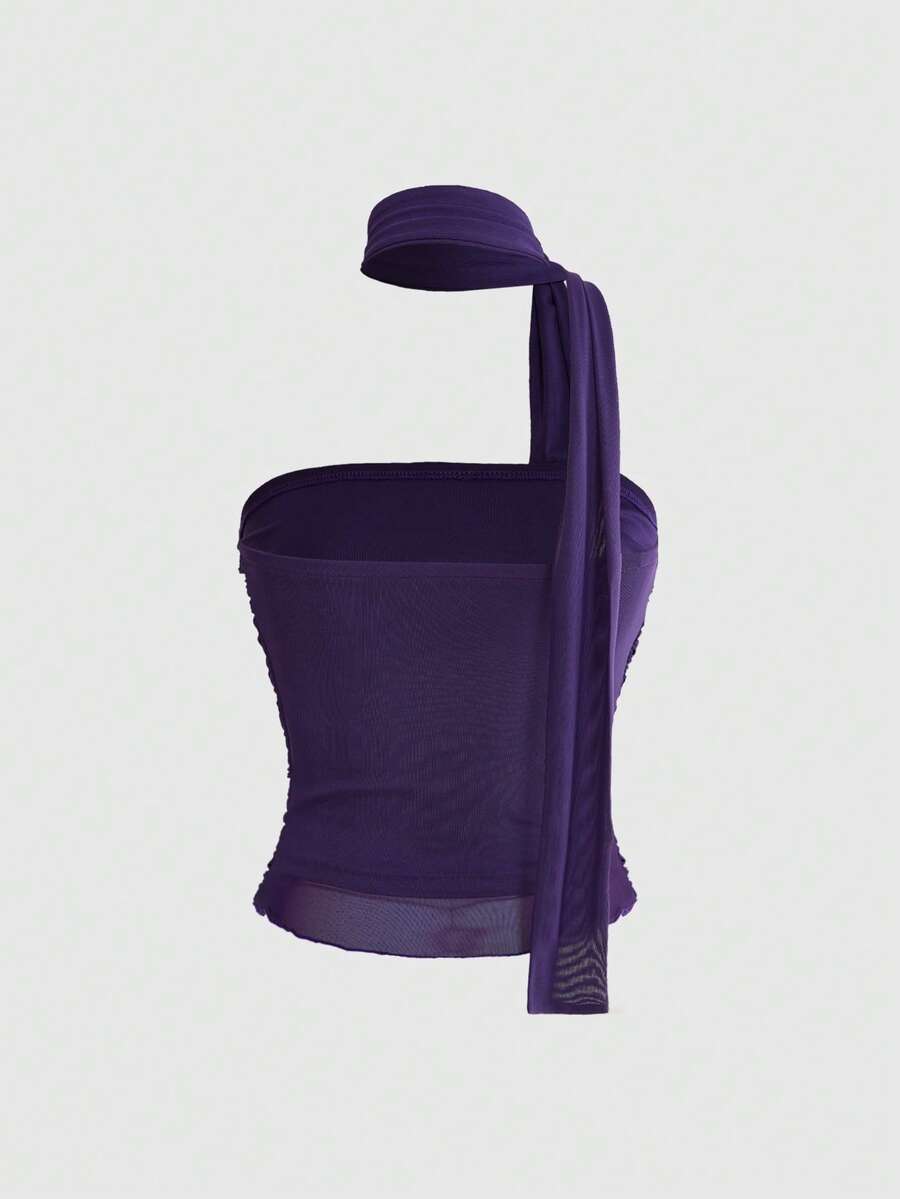 Women's black polka dot strapless tube top made of ruched mesh fabric featuring an asymmetrical hem and matching scarf.