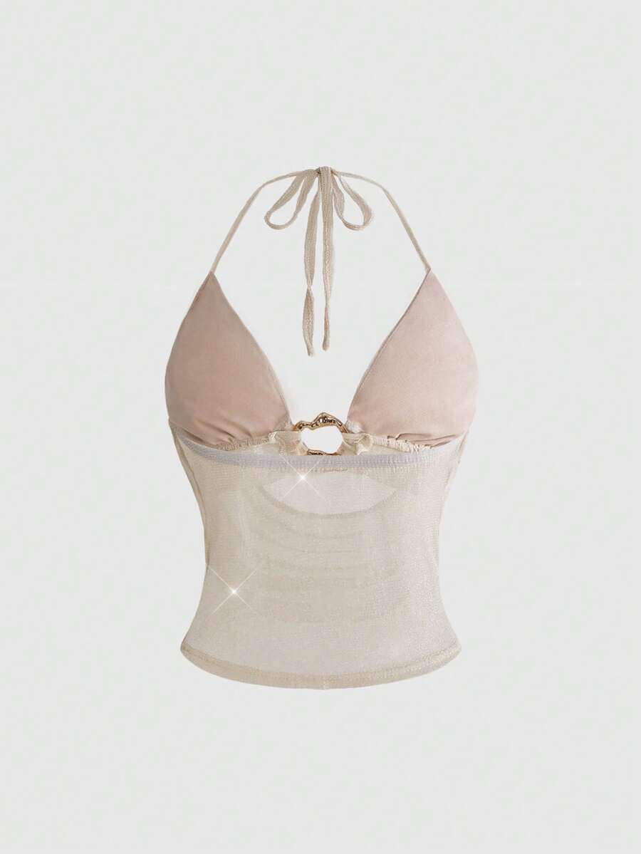 Women's glitter backless halter crop top with a draped neck and tie-up straps in metallic black knit fabric.