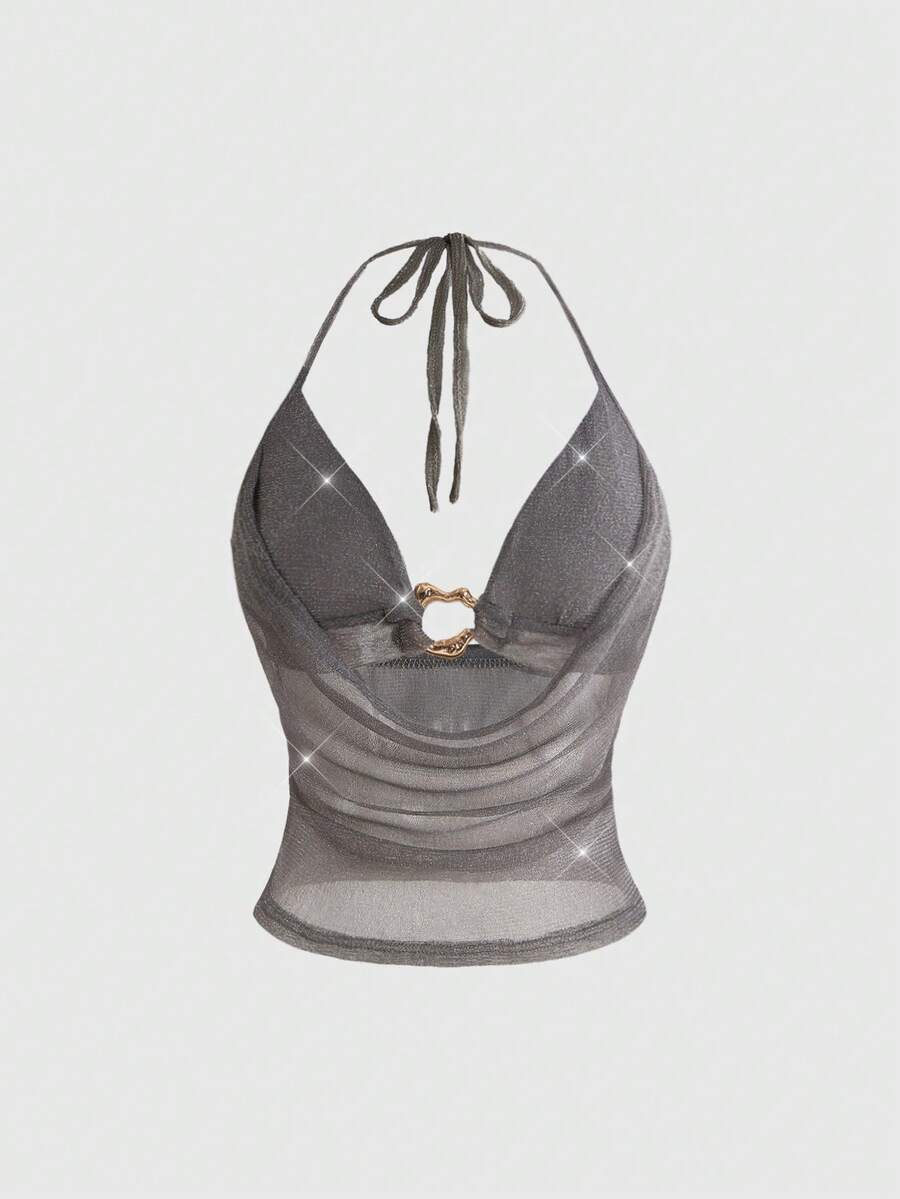 Women's glitter backless halter crop top with a draped neck and tie-up straps in metallic black knit fabric.