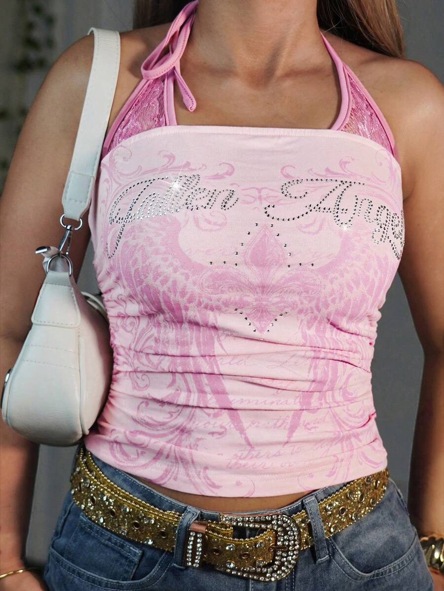 Pink Y2K sleeveless halter crop top with wing print, contrast lace trim, and backless tie detail.
