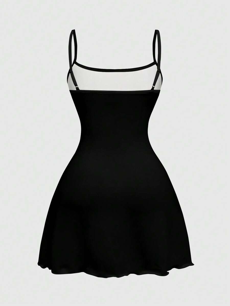Women's black backless cami mini dress featuring spaghetti straps, lettuce trim detail, high waist, and a flared hem design.