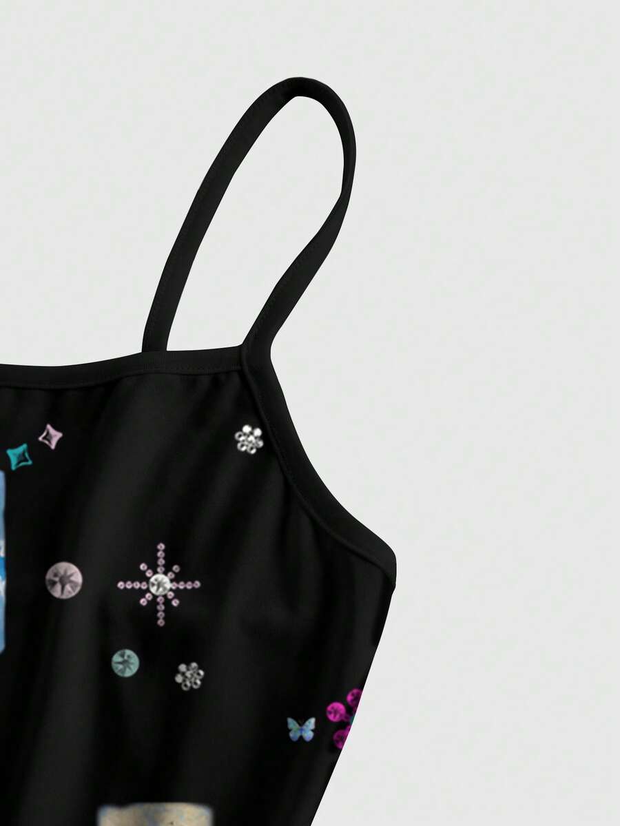 Women's black backless cami mini dress featuring spaghetti straps, lettuce trim detail, high waist, and a flared hem design.