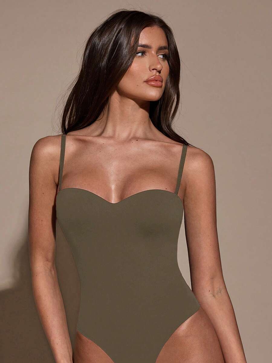 Apricot women's lace sheer camisole top featuring spaghetti straps, contrast lace trim, backless slim fit design, and knitted stretch fabric.