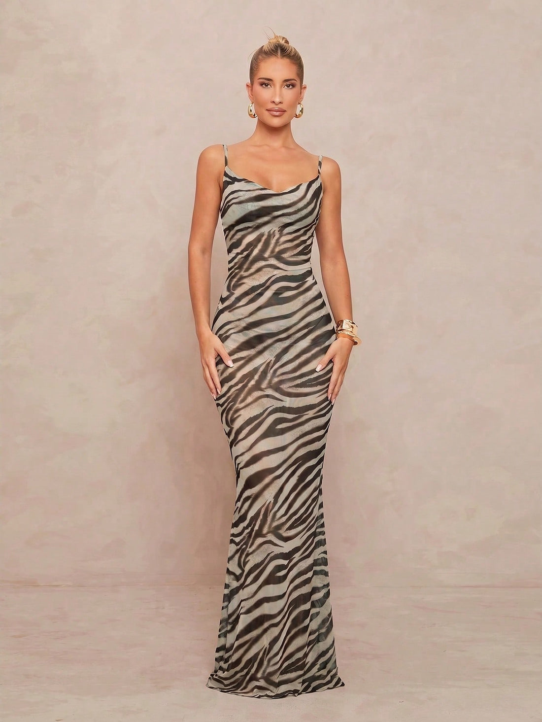 Multicolor animal print cowl neck bodycon maxi dress for women with spaghetti straps, ruched detail, open tie back, and mermaid hem.