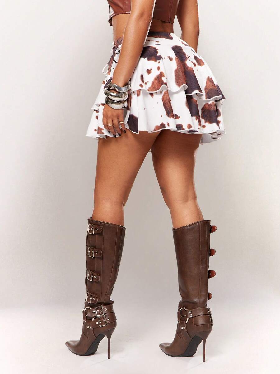 Women's black PU coated layered ruffle mini skirt featuring a high waist, tiered ruffle hem, and zipper detail.