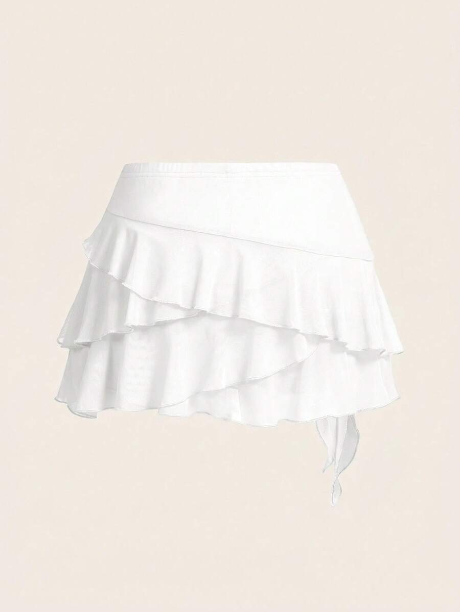 White tiered ruffle trim mini skirt for women with low waist, knot detail, mesh fabric, and casual Y2K boho design.