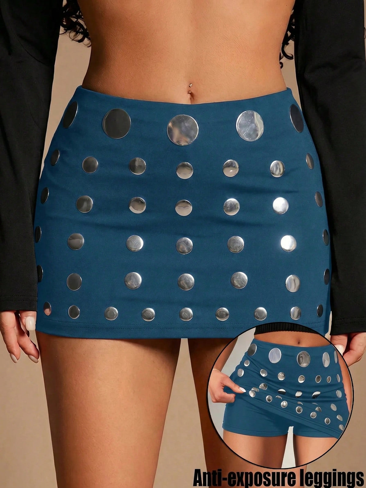 Women's black bodycon mini skort featuring a low waist, pleated side split hem, zipper closure, and built-in shorts.