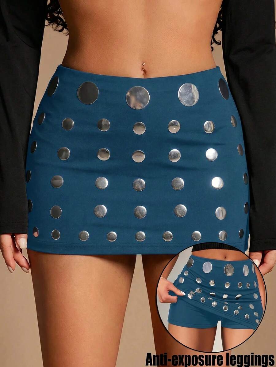Women's black bodycon mini skort featuring a low waist, pleated side split hem, zipper closure, and built-in shorts.