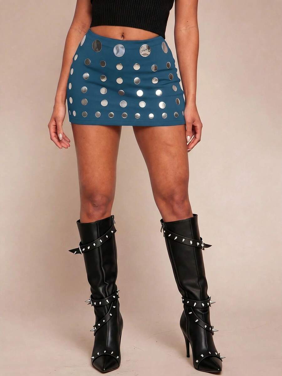Women's black bodycon mini skort featuring a low waist, pleated side split hem, zipper closure, and built-in shorts.