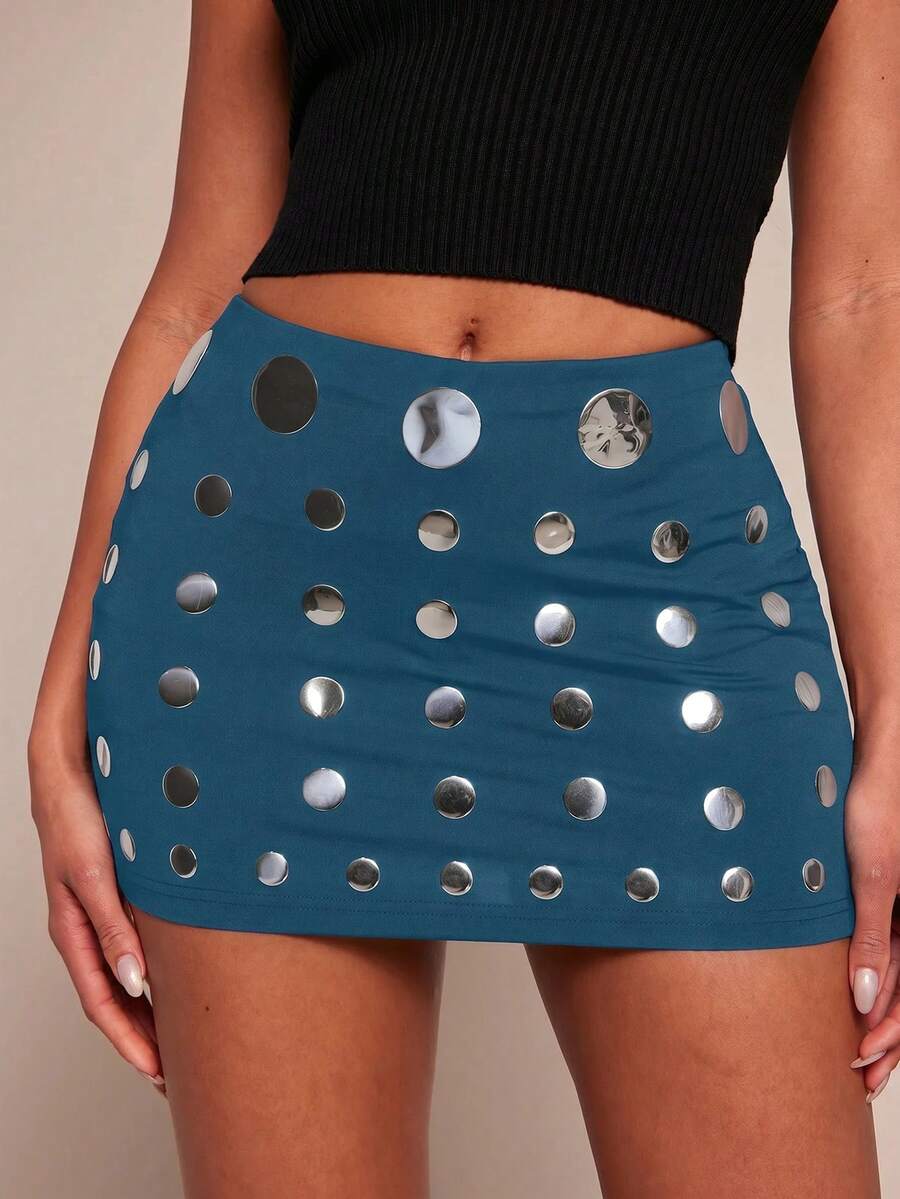 Women's black bodycon mini skort featuring a low waist, pleated side split hem, zipper closure, and built-in shorts.