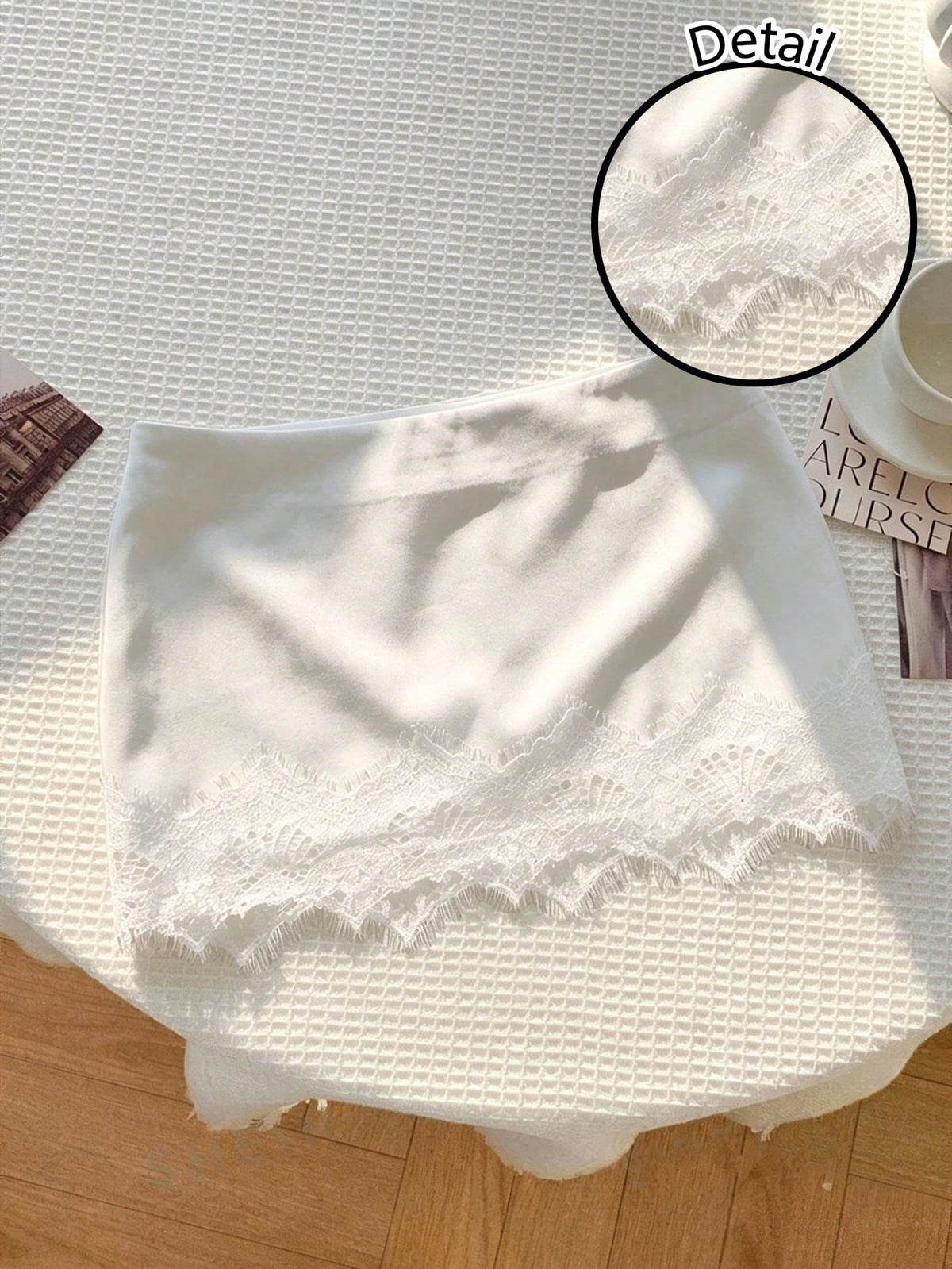 Women's white 100% cotton low waist mini skirt featuring a tropical print and zipper detail.