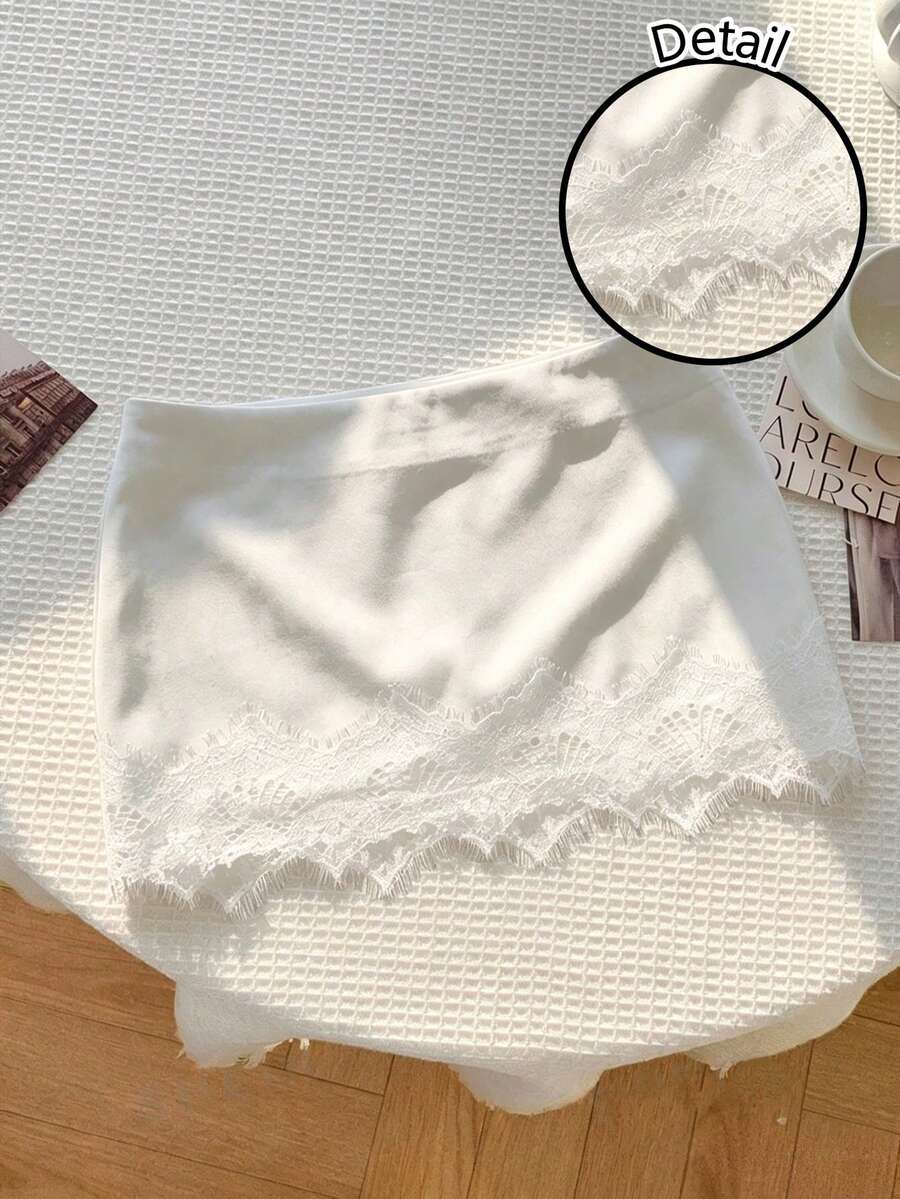 Women's white 100% cotton low waist mini skirt featuring a tropical print and zipper detail.