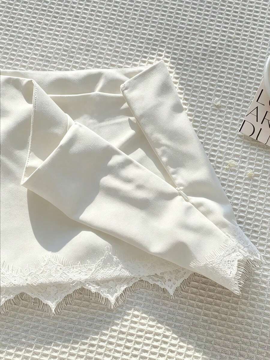 Women's white 100% cotton low waist mini skirt featuring a tropical print and zipper detail.