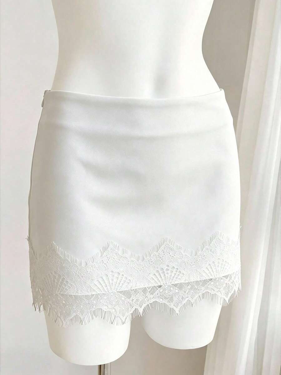 Women's white 100% cotton low waist mini skirt featuring a tropical print and zipper detail.