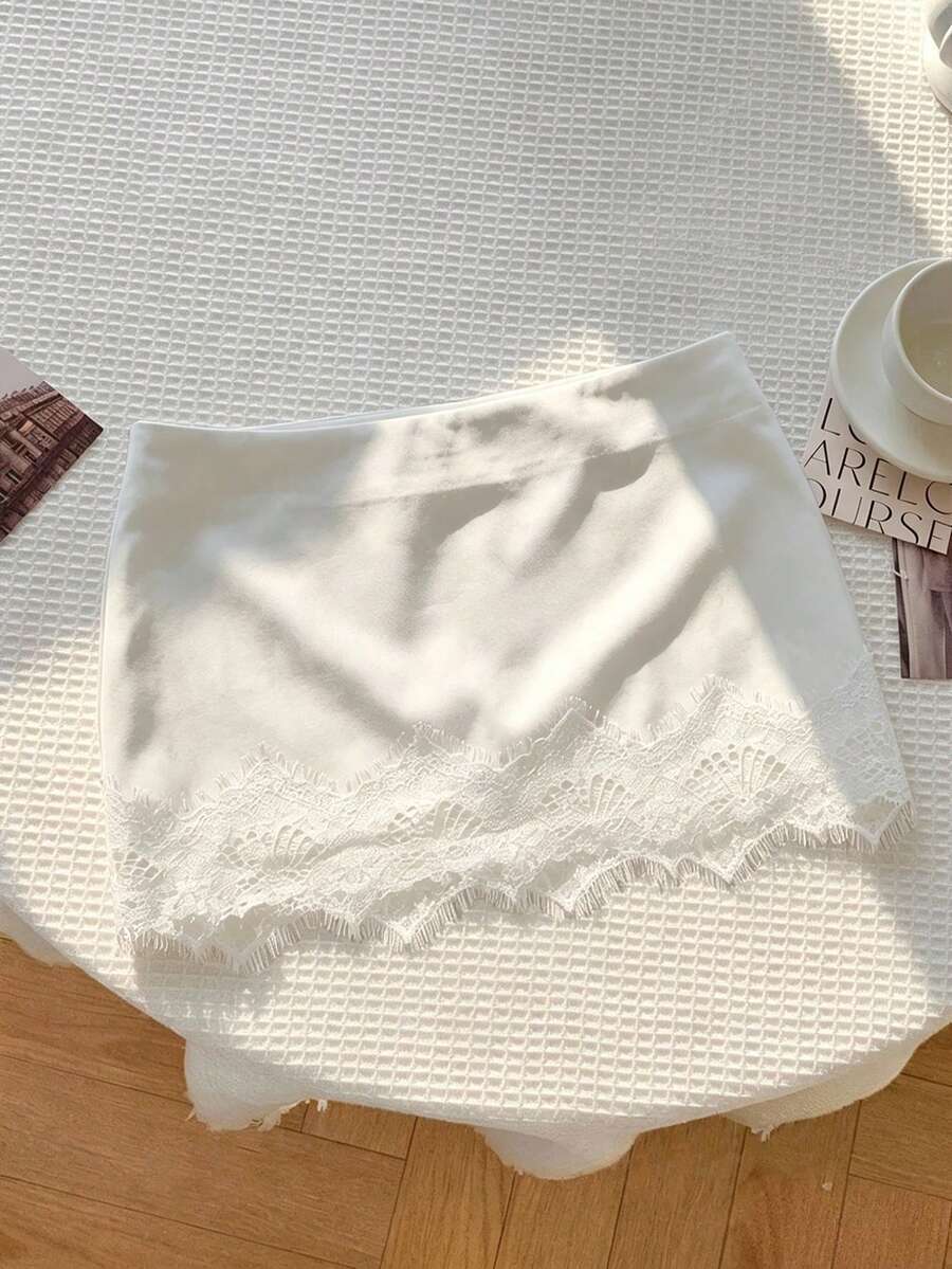 Women's white 100% cotton low waist mini skirt featuring a tropical print and zipper detail.