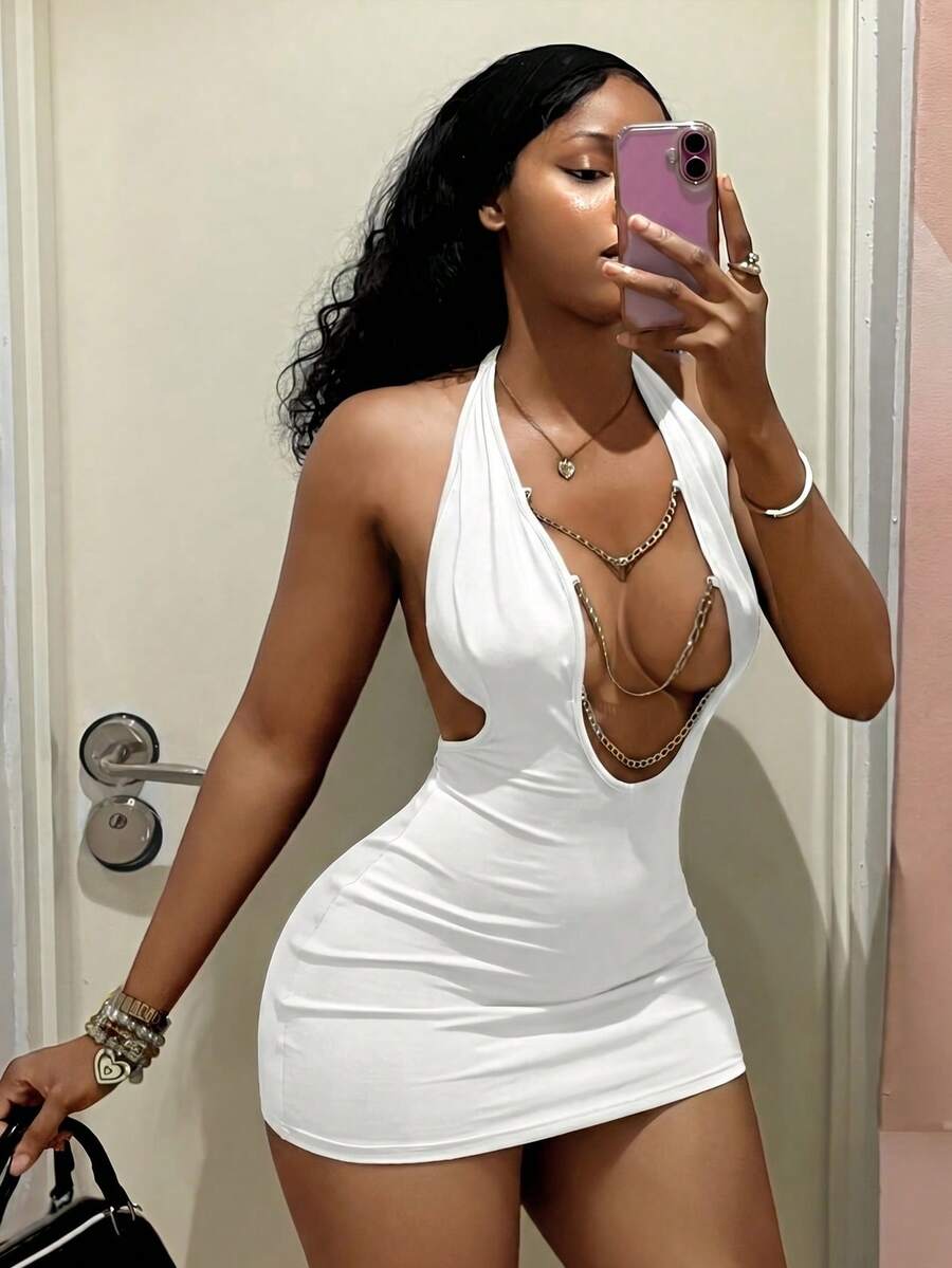 Women's black deep V-neck halter bodycon mini dress featuring a backless design with chain decor detail.