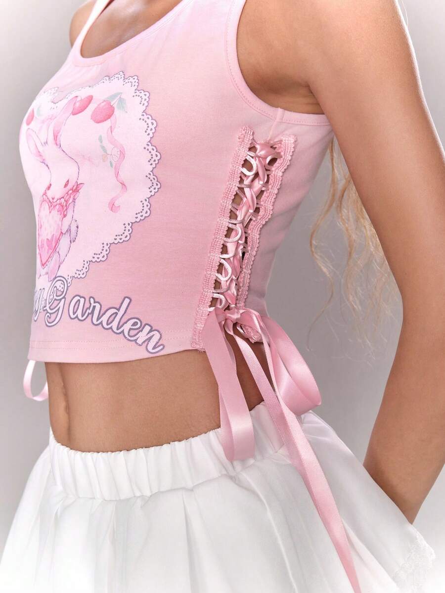 Pink slim fit cropped tank top with scoop neckline, featuring cute rabbit and heart print, rhinestone details, and front ribbon bow accent.