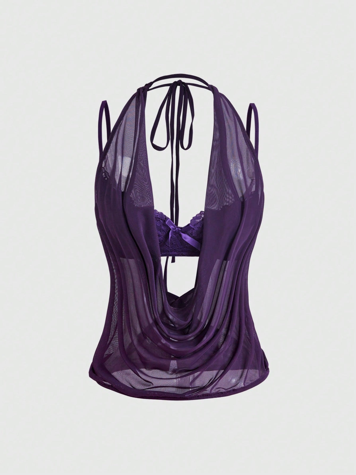 Women wearing a black draped backless halter crop top layered over a boned lace camisole.