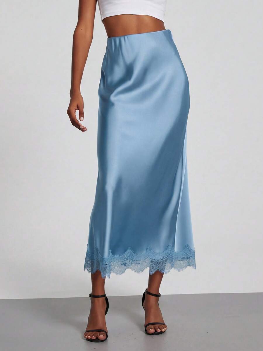 Women's black lace patchwork satin skirt featuring a long bodycon silhouette and natural mid waist design.