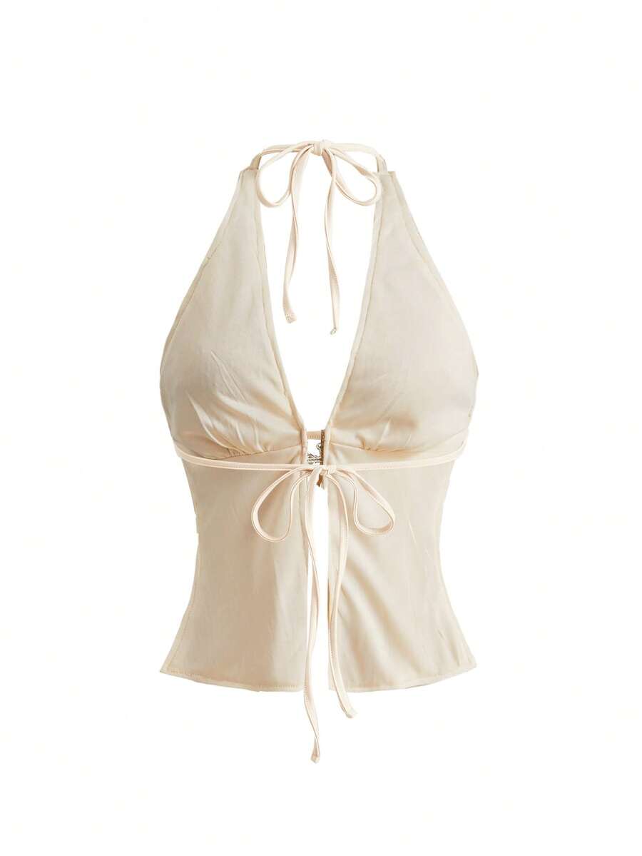 Women's white backless sequin halter neck tank top with knot details and slim fit boho style.
