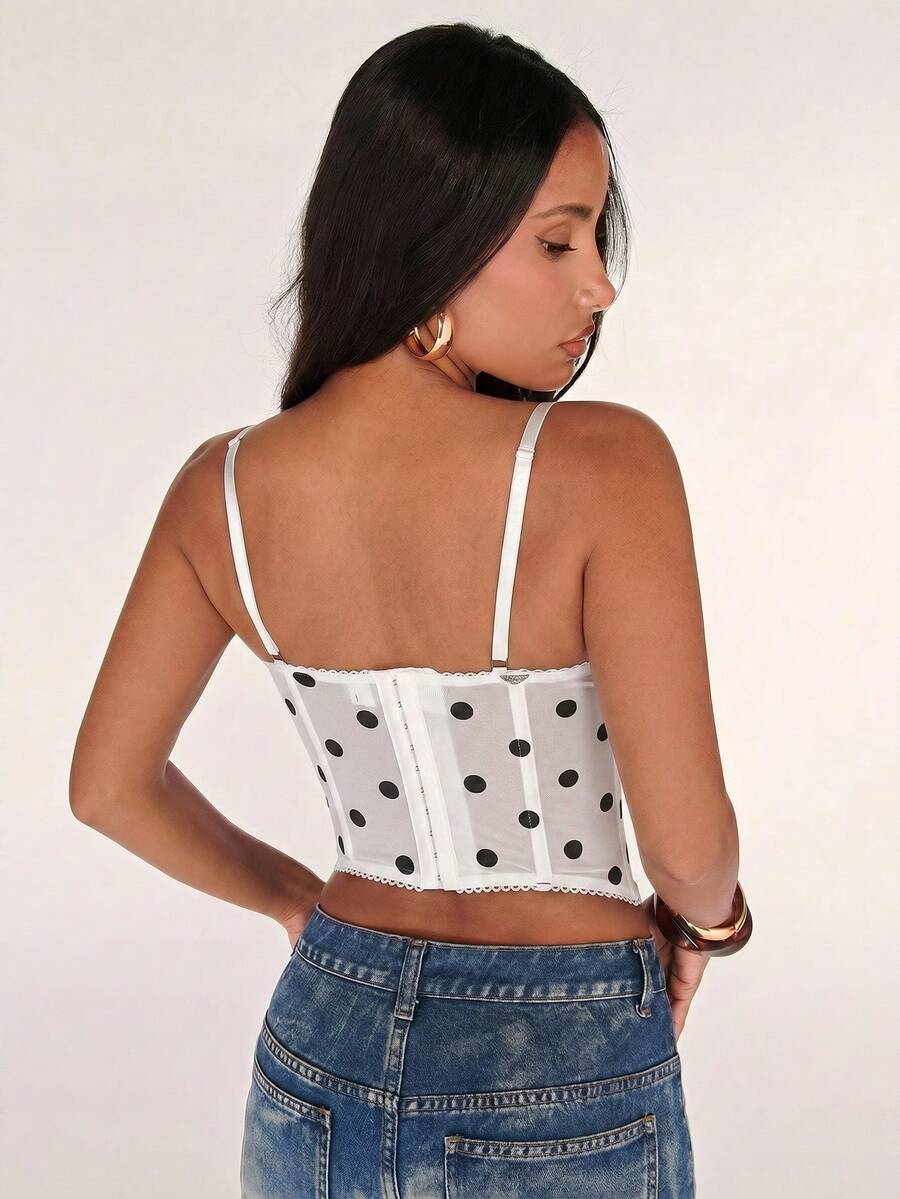 Black women’s lace cami top with spaghetti straps, contrast lace details, and an asymmetrical hem, styled as a slim-fit lined casual top.
