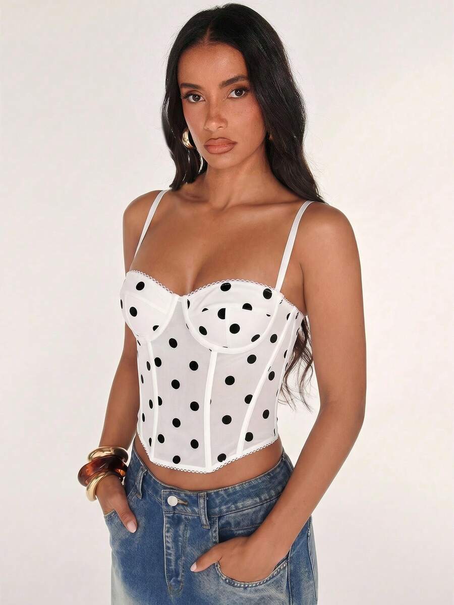Black women’s lace cami top with spaghetti straps, contrast lace details, and an asymmetrical hem, styled as a slim-fit lined casual top.