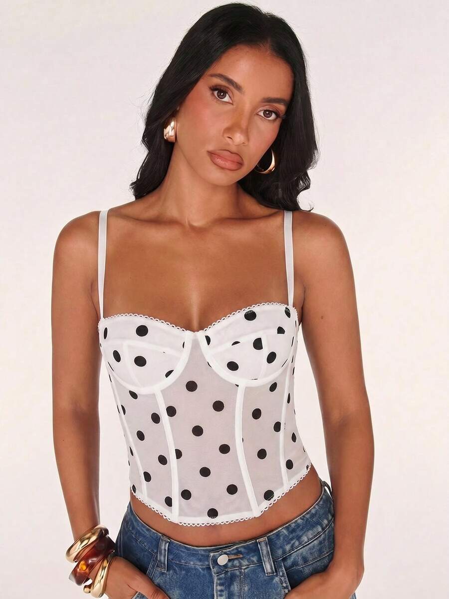 Women’s camisole top with cup detail, spaghetti straps, lined body, and slim fit design in knitted fabric with an asymmetrical hem.