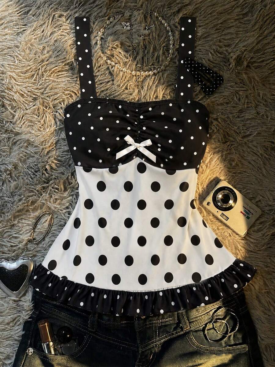 Multicolor women's wide strap tank top featuring polka dot pattern, ruched shirred bodice, and flared ruffle hem.