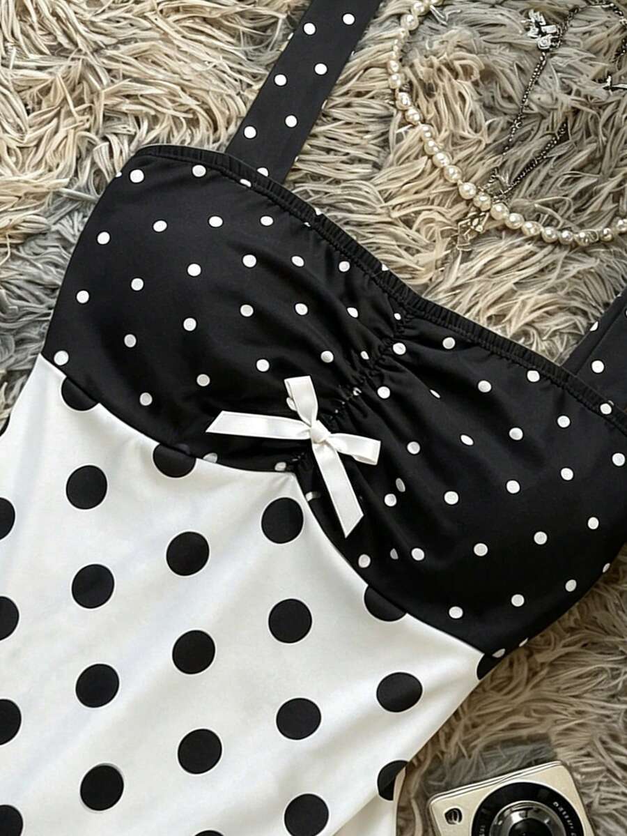 Multicolor women's wide strap tank top featuring polka dot pattern, ruched shirred bodice, and flared ruffle hem.