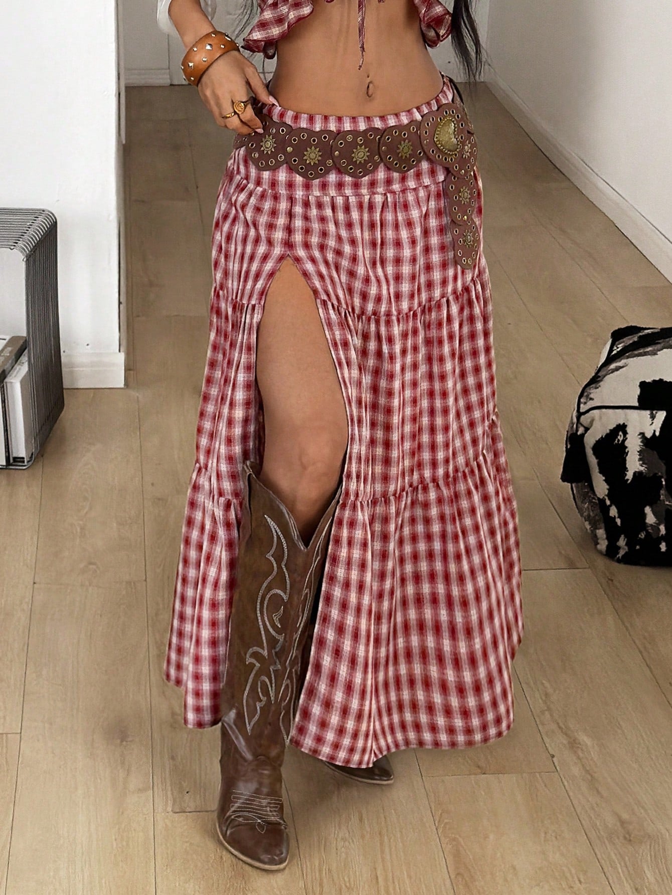 Women's black low waist split thigh long skirt featuring semi-sheer textured fabric and a flared skinny fit.