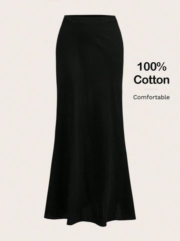 Women's black woven mermaid maxi skirt featuring a solid color design, mid waist, and 100% cotton fabric.