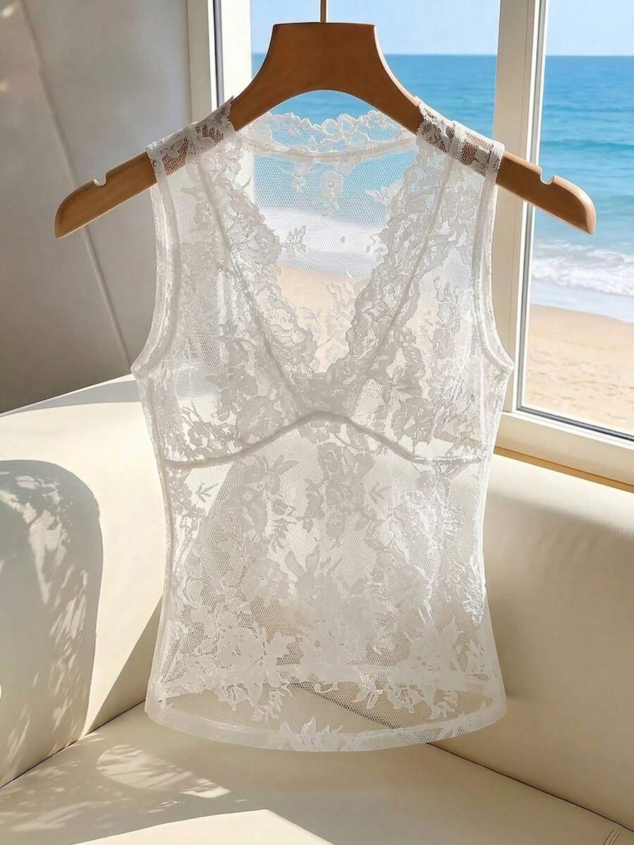 Franclia women's black semi-sheer lace camisole featuring a deep V-neckline with contrast lace trim in a slim fit sleeveless design.