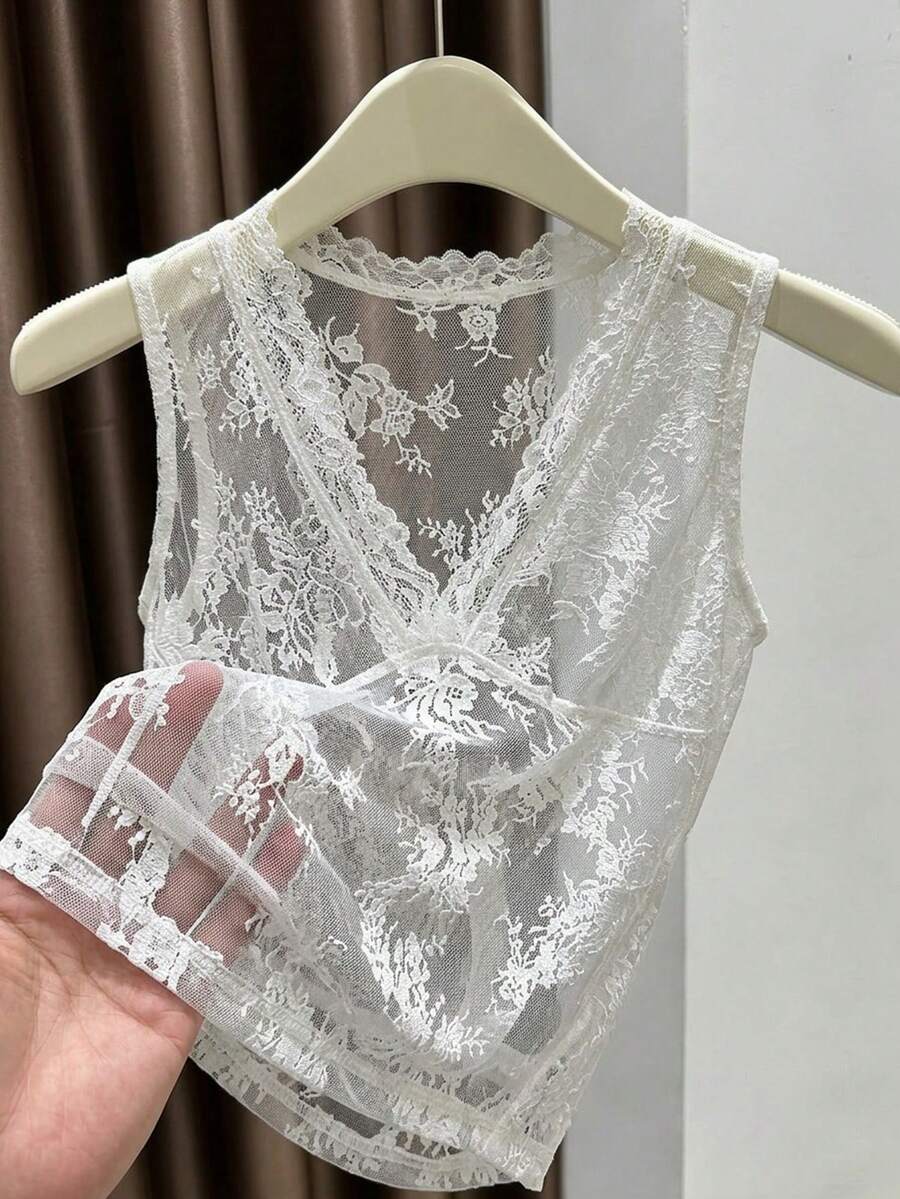 Franclia women's black semi-sheer lace camisole featuring a deep V-neckline with contrast lace trim in a slim fit sleeveless design.