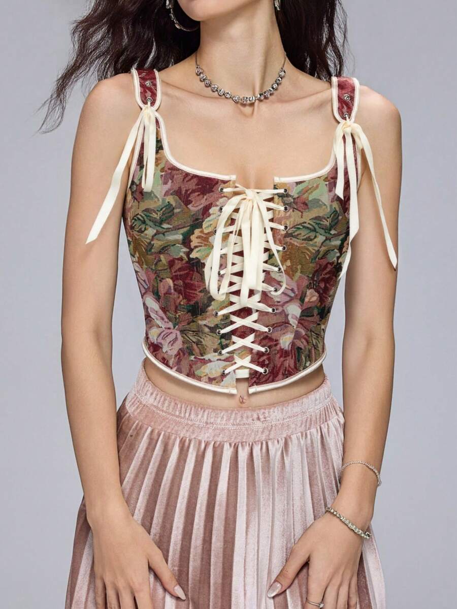 Women's retro floral print bustier top with shoulder straps, lace-up tie back, zipper, and boned construction in a romantic vintage style.