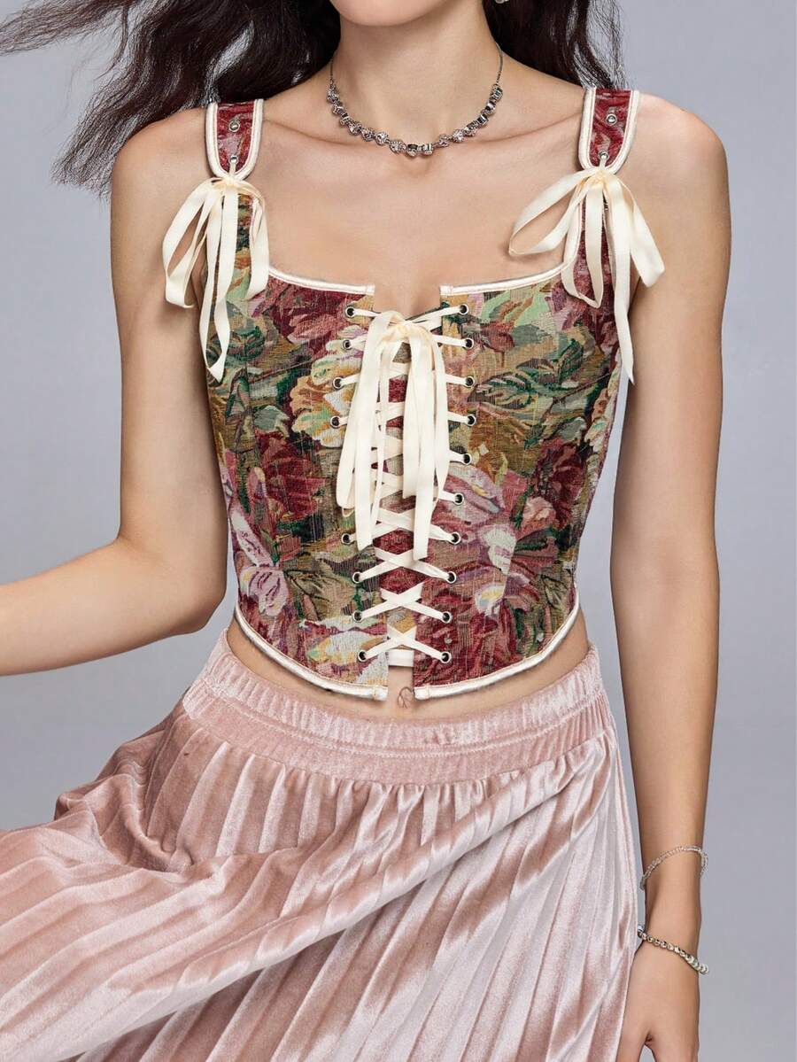 Women's retro floral print bustier top with shoulder straps, lace-up tie back, zipper, and boned construction in a romantic vintage style.