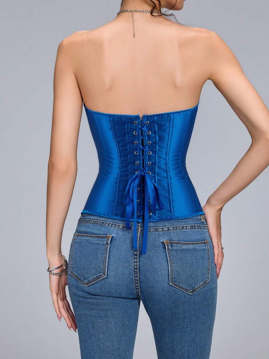 Blue satin bustier corset with front closure, back lace-up detail, and boned shaping for a retro-inspired party look.