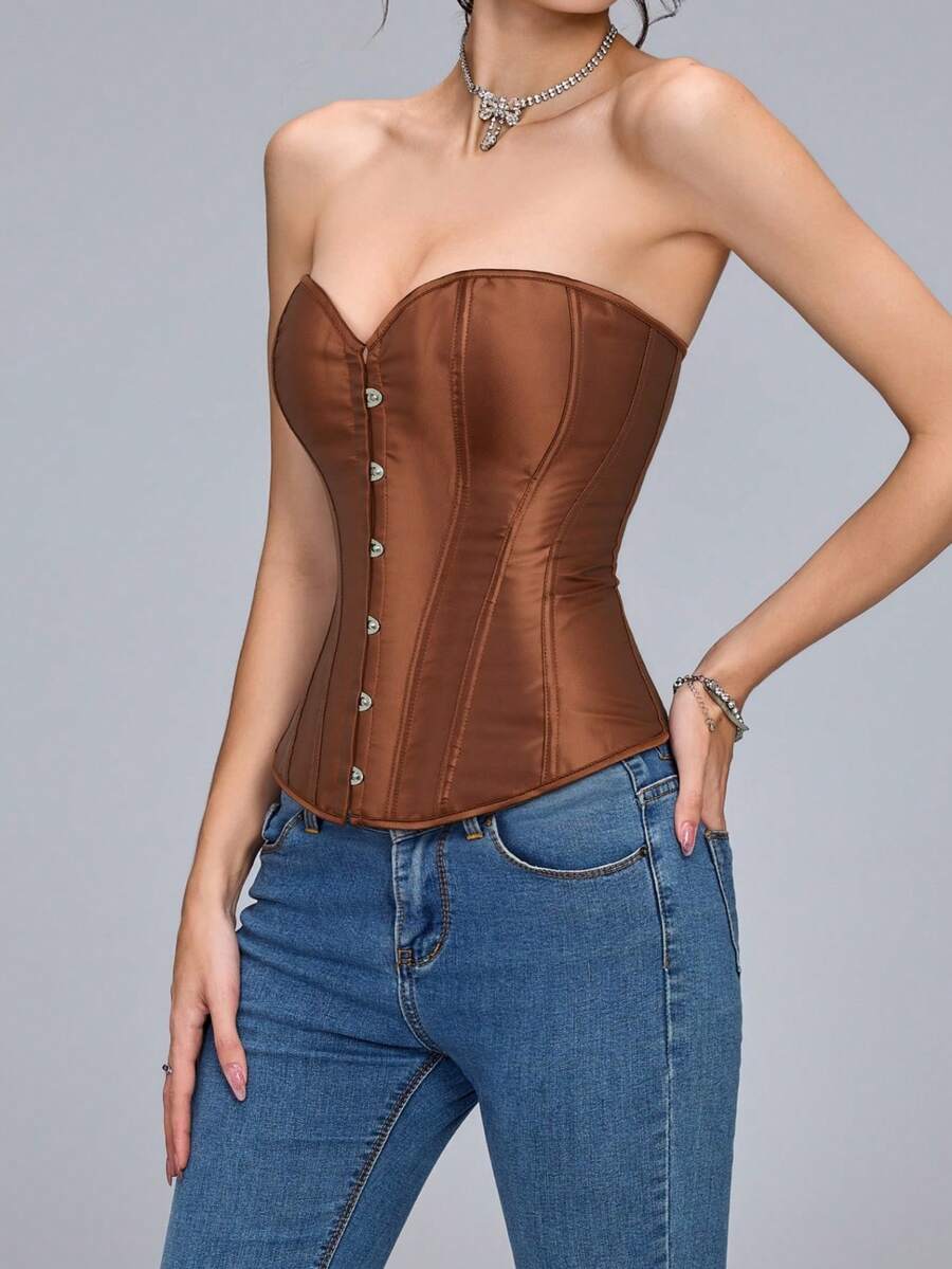 Blue satin bustier corset with front closure, back lace-up detail, and boned shaping for a retro-inspired party look.