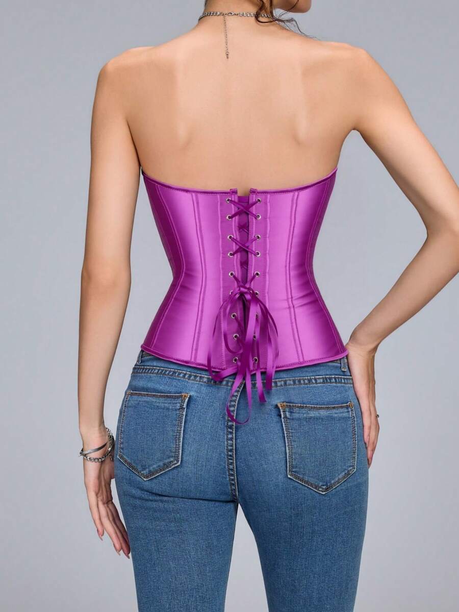 Blue satin bustier corset with front closure, back lace-up detail, and boned shaping for a retro-inspired party look.