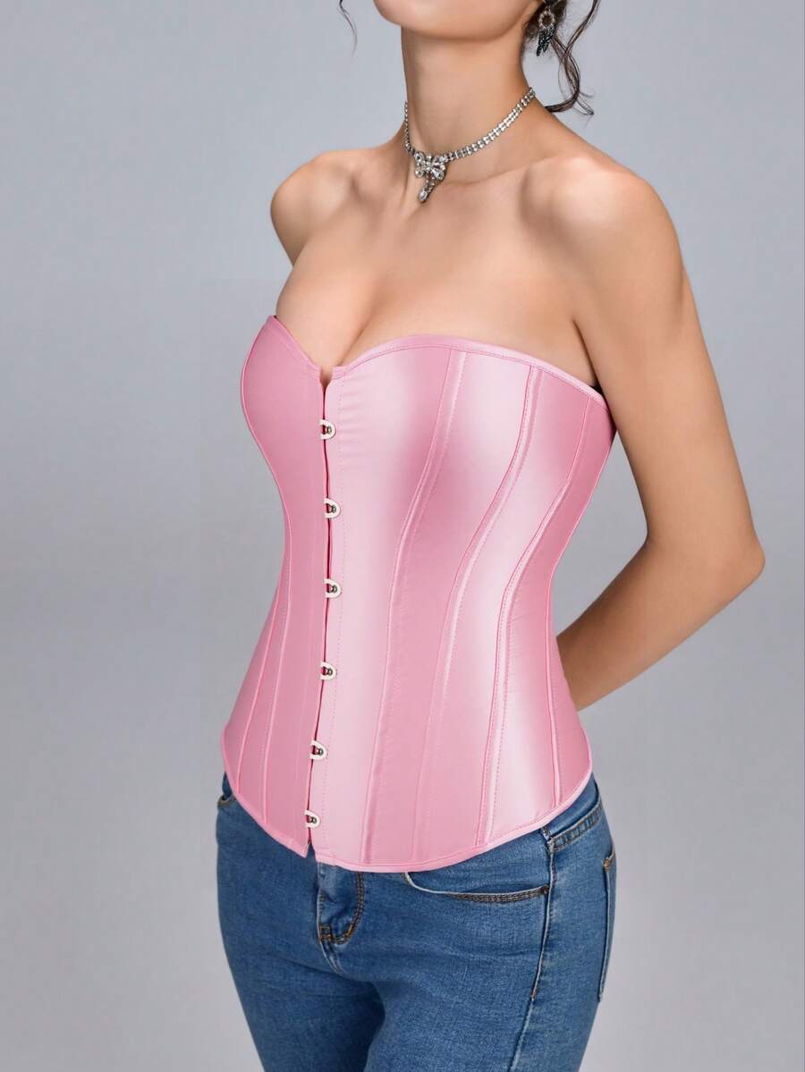 Blue satin bustier corset with front closure, back lace-up detail, and boned shaping for a retro-inspired party look.