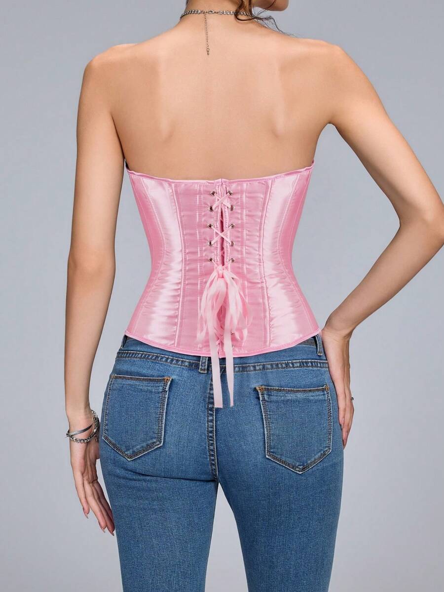 Blue satin bustier corset with front closure, back lace-up detail, and boned shaping for a retro-inspired party look.