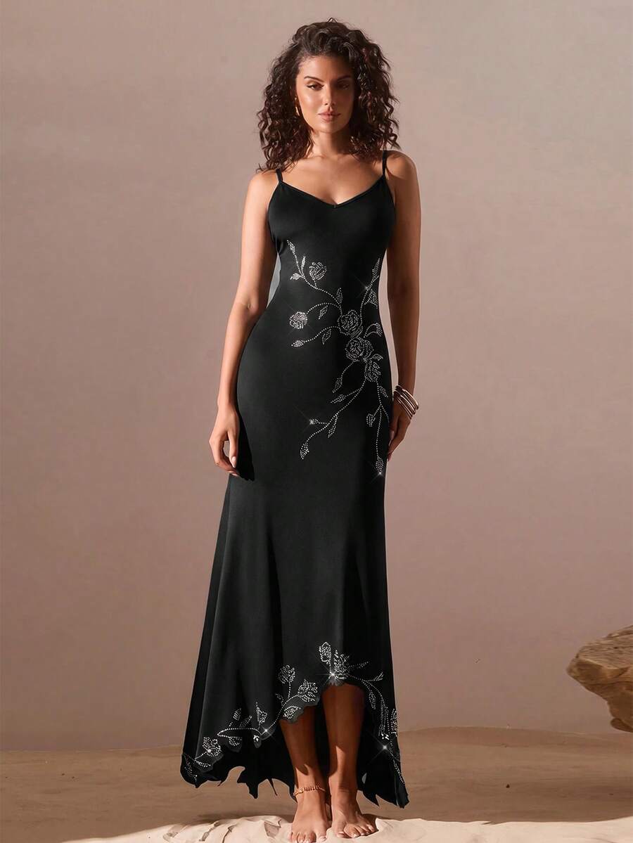 Black sleeveless asymmetrical cami maxi dress for women featuring spaghetti straps, 3D rose accent, arm sleeves, and a slim fit knitted design.