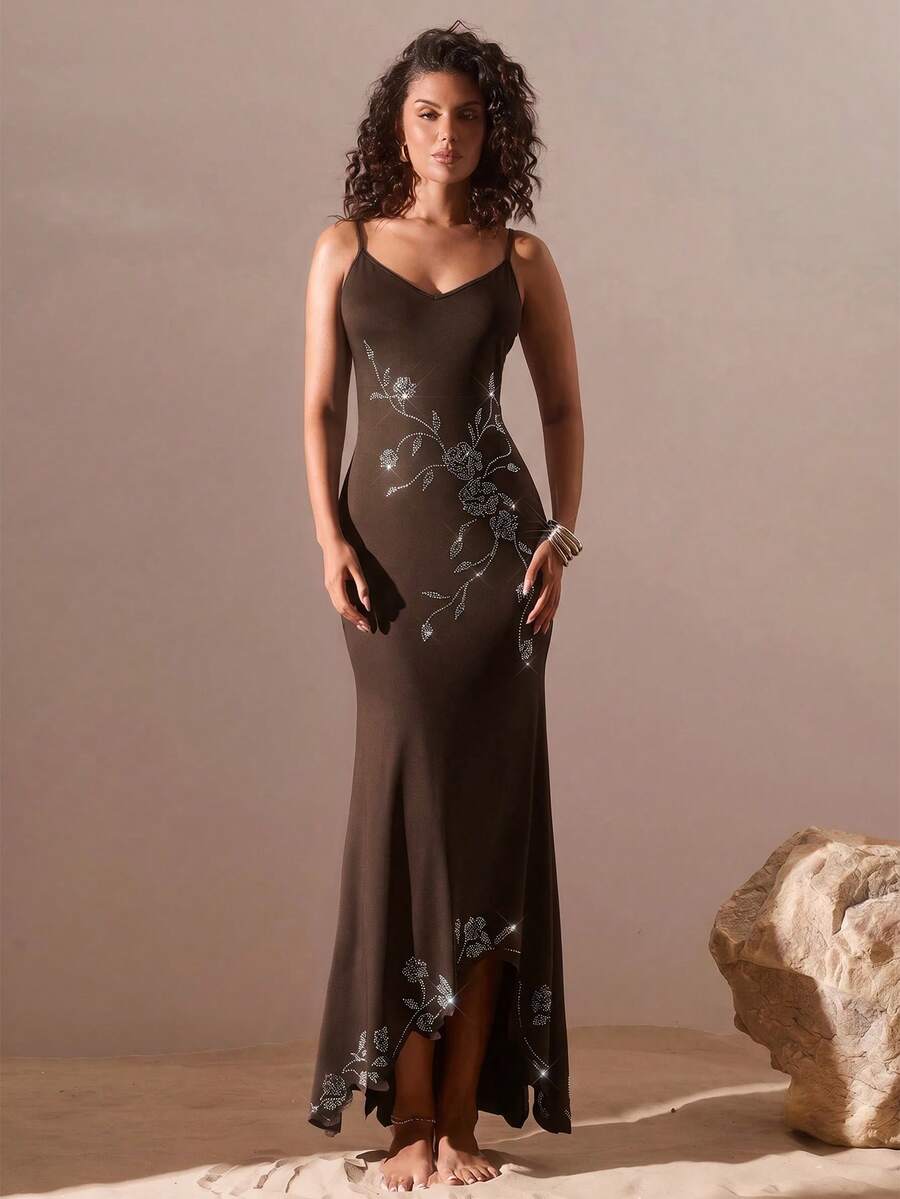 Black sleeveless asymmetrical cami maxi dress for women featuring spaghetti straps, 3D rose accent, arm sleeves, and a slim fit knitted design.